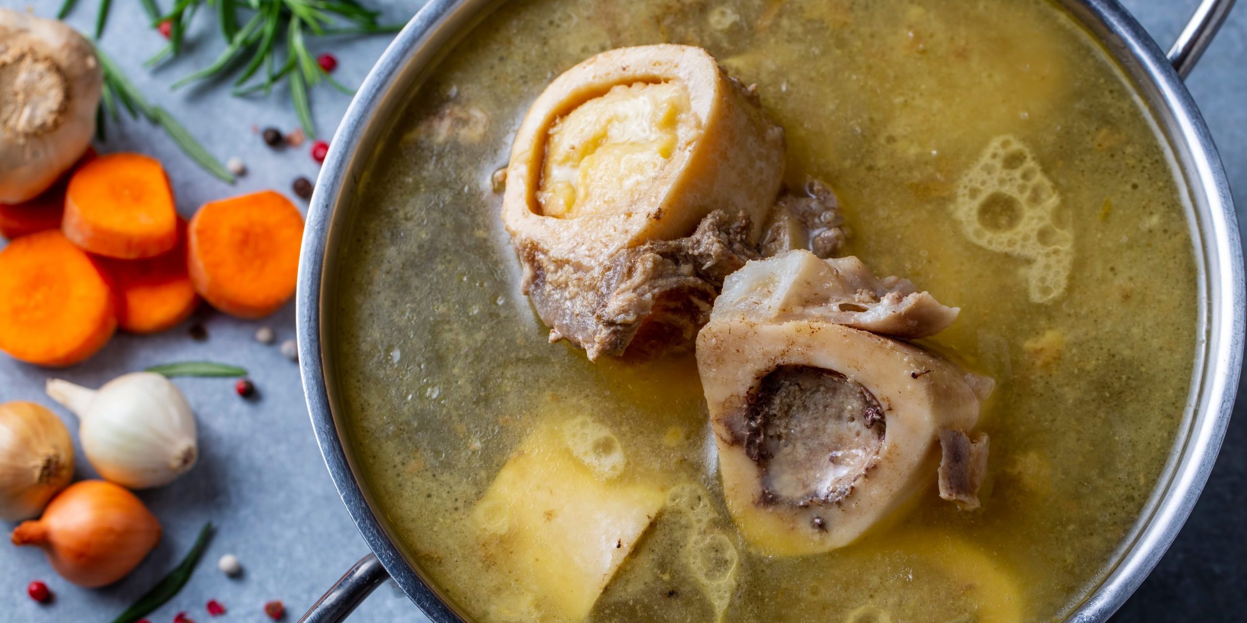 Boiled bone and broth. Homemade beef bone broth is cooked in a pot on. Bones contain collagen, which provides the body with amino acids, which are the building blocks of proteins.
